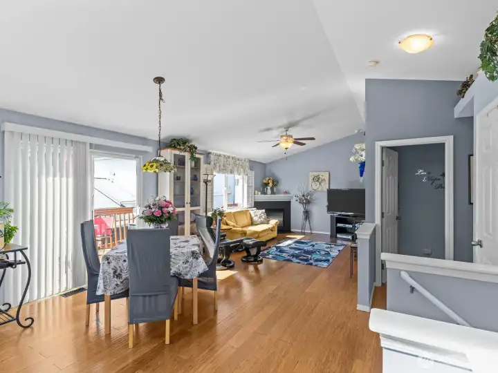 Upon entering and heading up the stairs, you're warmly welcomed by the bamboo flooring and abundance of natural light pouring through the windows.