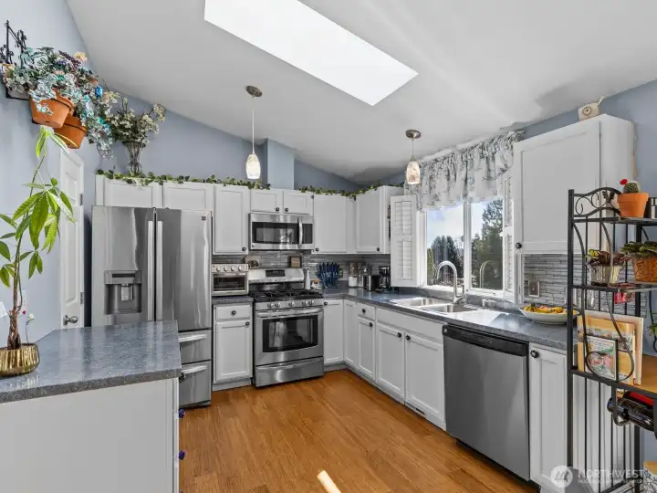 The well laid out kitchen has a great amount of cabinet and counter space for all of your cooking and baking needs.