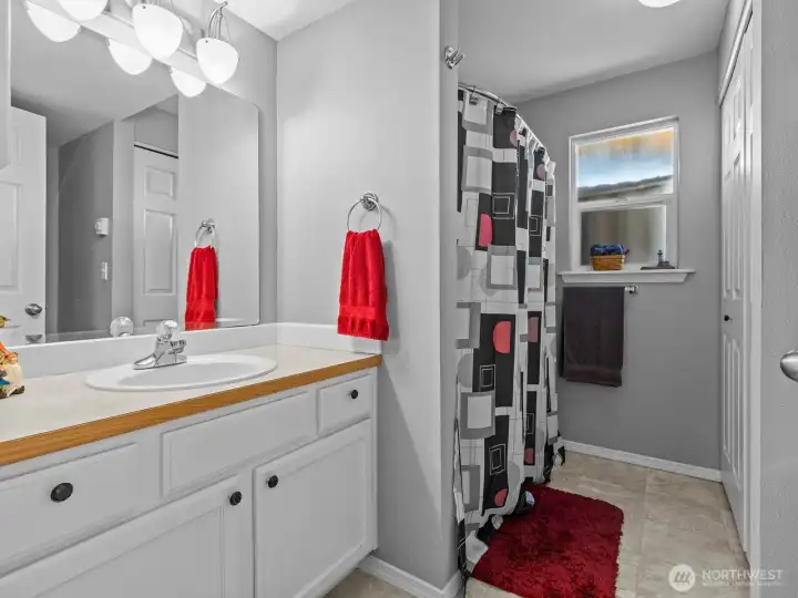 Down the hall is the bathroom.