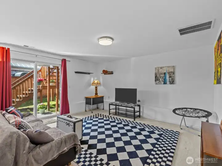 Finalizing the inside is the rec room with access to the backyard.