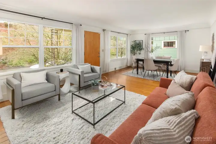 Open living dining area set up off the street and filled with natural light.