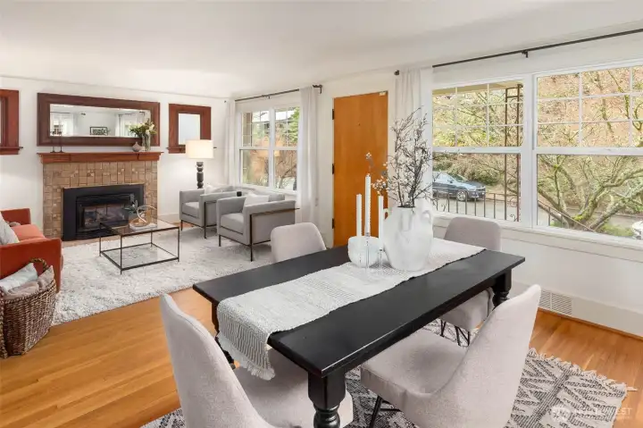 Open living dining area set up off the street and filled with natural light.