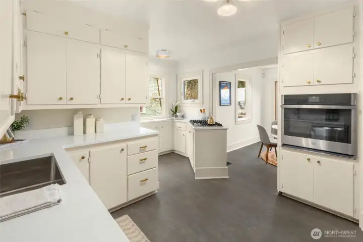 Updated kitchen with casual eating area open to spacious view deck.