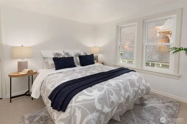 One of two upstairs bedrooms with large closets & great storage space.