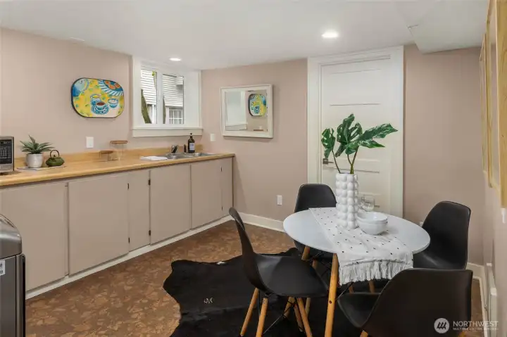 Lower level laundry area and kitchenette great space for great flexible space for a rec room, guest suite, or work-from-home setup.