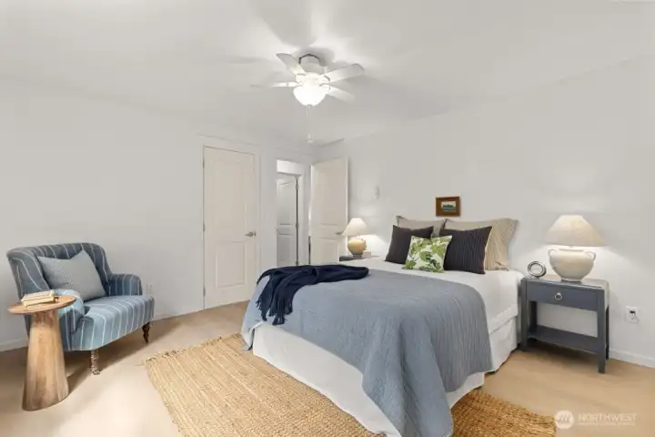 Primary bedroom with door to bathroom closed