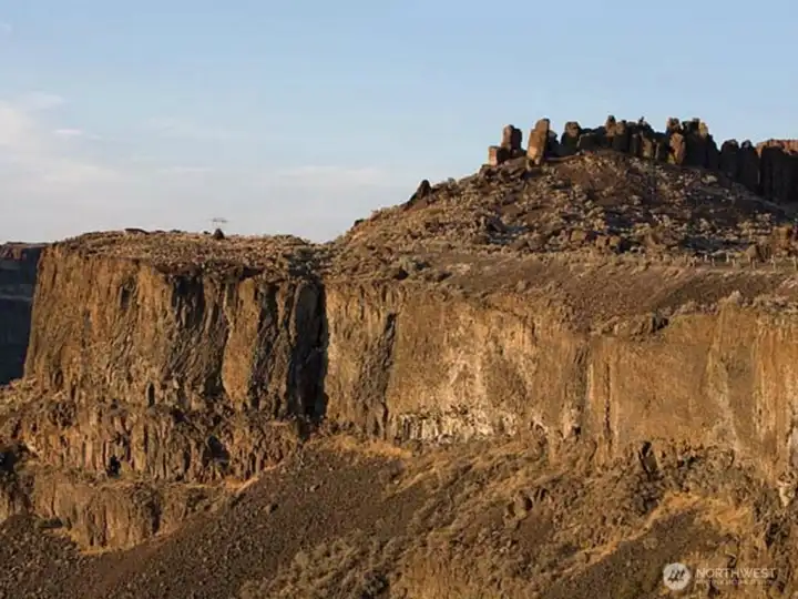 Stunning cliff vistas.  400 foot shear cliff walls to canyon floor below. Head of Frenchman Coulee has 50 developable acres.  Equestrian trails exist from the highest ridges to the canyon floor below.  Famous "FEATHERS" rock out-cropping shown in distance.