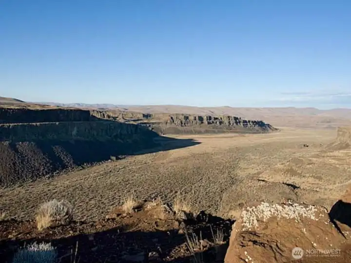 Canyon floor continues onto 3200 acres of public land with many trails for horseback riding, hiking, mountain biking and more!    Colubmia River boat launch and future marina site is just around the corner in the far distance.