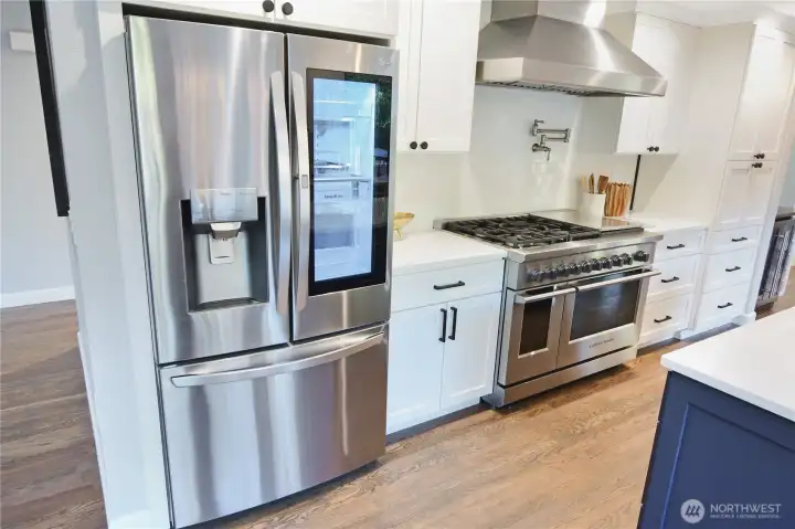 This fabulous kitchen remodel features high end appliances.