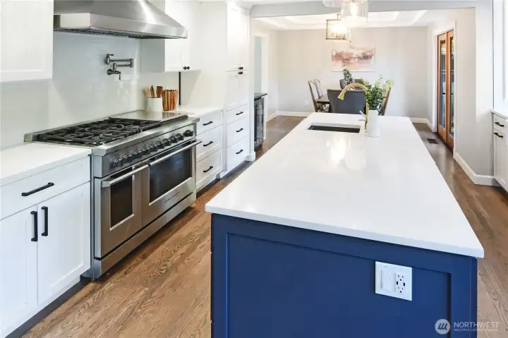Enjoy a large island with prep sink well placed opposite the range oven.