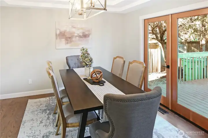 Spacious dining area is open to the kitchen and has french doors to the deck. Enjoy wood floors throughout the main level.