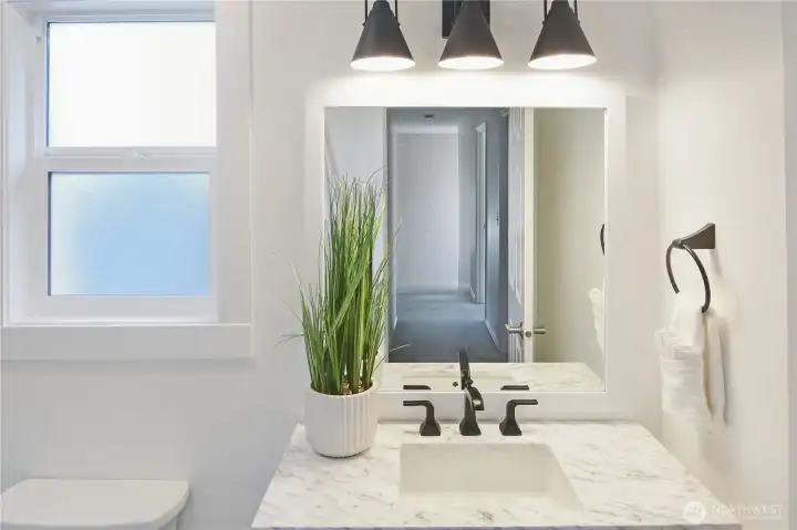 Enjoy fabulous quartz countertop and modern light fittings.