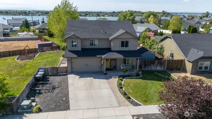 Ample parking, large lawn, tasteful landscaping with curbing! This house has it all!