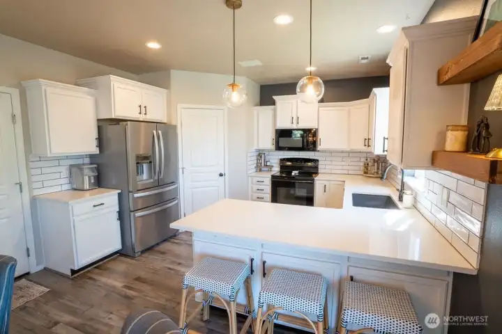 Newer stone countertops and tile backsplash