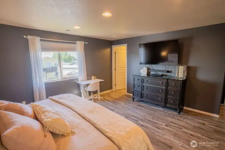 Guest bed looking towards bathroom suite