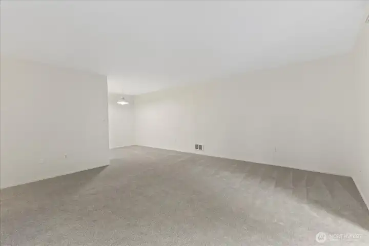 Living room with dining room beyond.