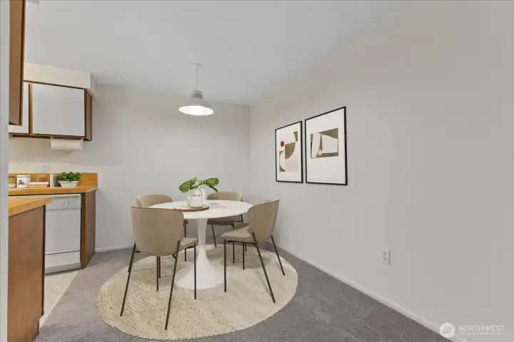 Virtually staged dining room off of kitchen.