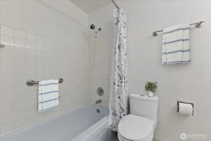 Virtually staged bathroom with tub.