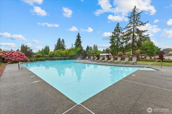 Beautifully maintained community pool is just steps away and offers ample space to relax and enjoy the summer sunshine with large lounging area.