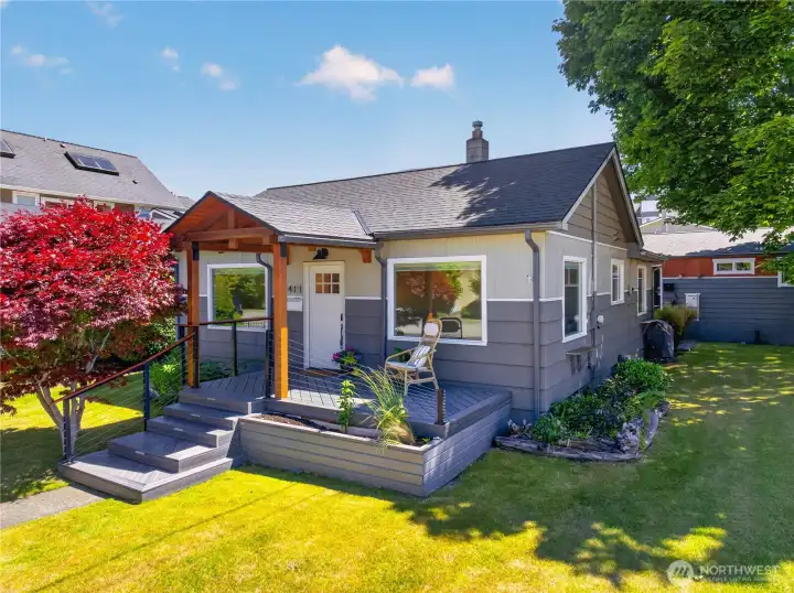 Charming and thoughtfully updated home featuring inviting curb appeal, a welcoming covered porch, and beautifully landscaped grounds in a desirable in-town location.