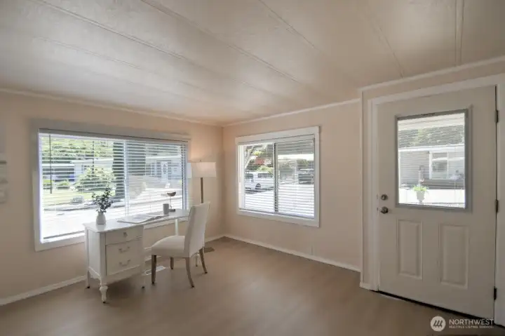 Open the door to the bright and sunny expansive living room with new double-paned windows covered by 2" wood blinds to allow sun and privacy control. Open the door to the bright and sunny expansive living room with new double-paned windows covered by 2" wood blinds to allow sun and privacy control.
