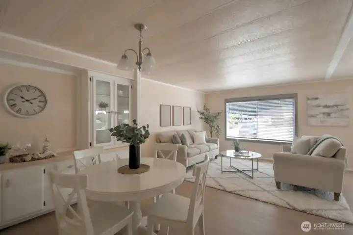 The living room flows into the dining area. The built-in cabintry provides great storage and attractive display shelves. The living room flows into the dining area. The built-in cabintry provides great storage and attractive display shelves.