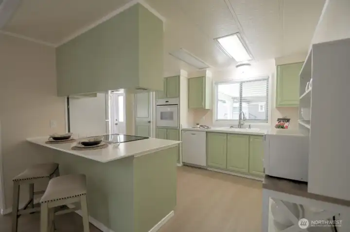 Another view of the kitchen and the informal counter seating for two! Another view of the kitchen and the informal counter seating for two!