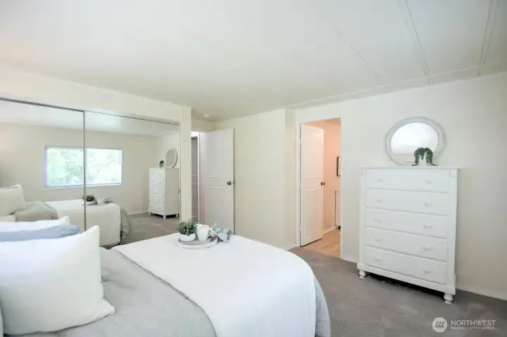 Primary bedroom with door to ensuite Primary bedroom with door to ensuite