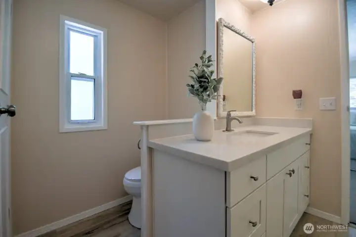 New toilet tucked behind the half wall New toilet tucked behind the half wall