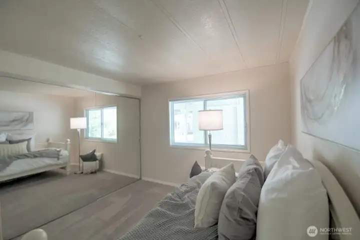 The bedroom is extra bright and sunny thanks to the wall of mirrored closets The bedroom is extra bright and sunny thanks to the wall of mirrored closets