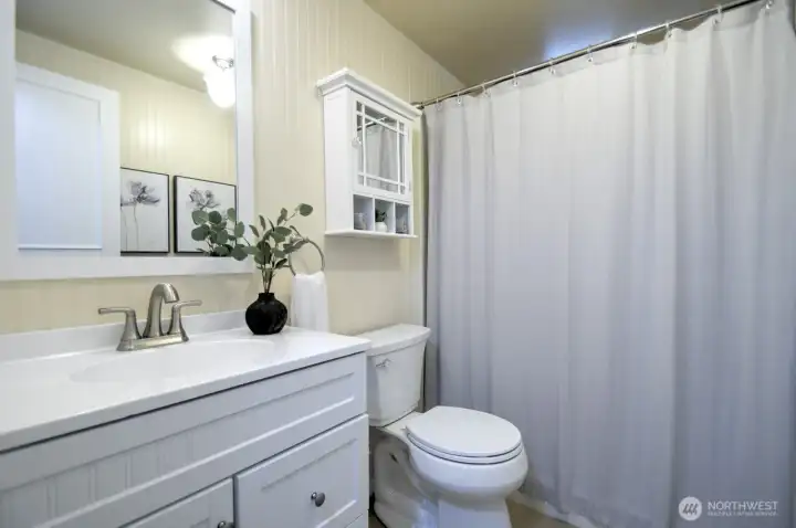 Hallway bathroom with new vanity, toilet and flooring Hallway bathroom with new vanity, toilet and flooring
