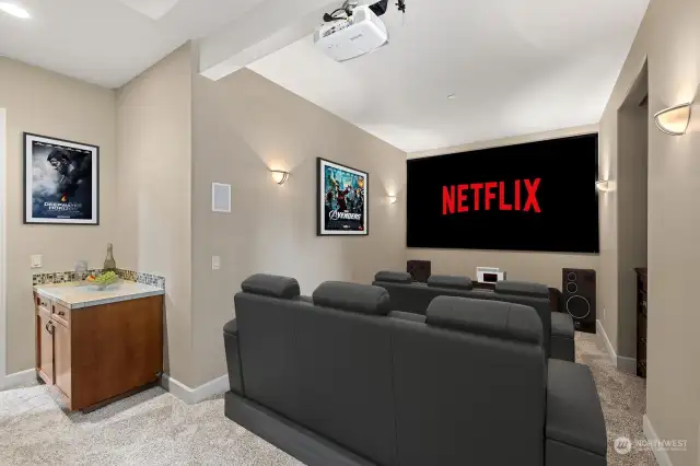 Theater room with projector and screen (Virtually Staged)