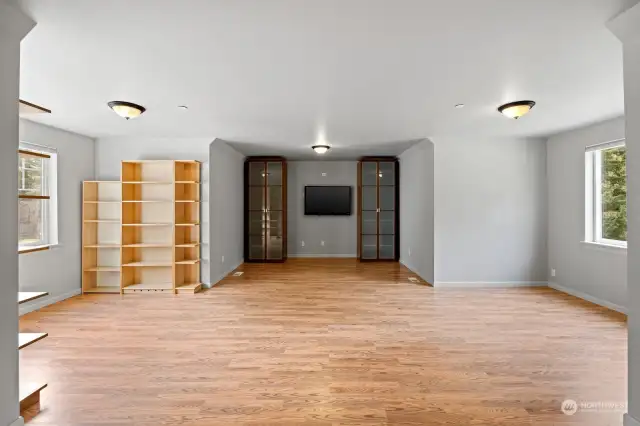 Upstairs bonus room with laminate floors- perfect workout space
