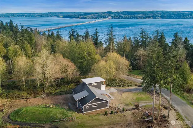 Sited on a shy half acre lot with impressive views from every angle, accompanied by your own shared deeded beach access, and plenty of forested areas to explore.