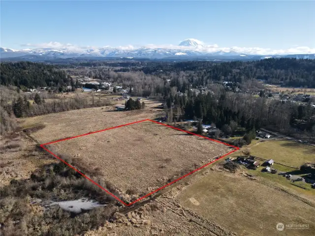 Buckley WA with a South Prairie post office box. 10 AC flat with Mt Rainie view. Current zoning is Open Space Agricultural Previous zoning was RESIDENTIAL. Very easy to put zoning back into residential.