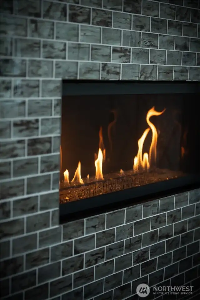 Elegant tile surround and cozy,  gas-powered warmth—effortless comfort with timeless style.