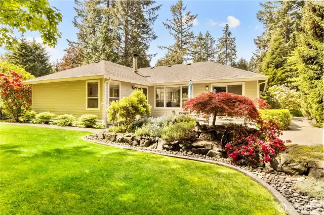 Custom landscaping surrounds the property.