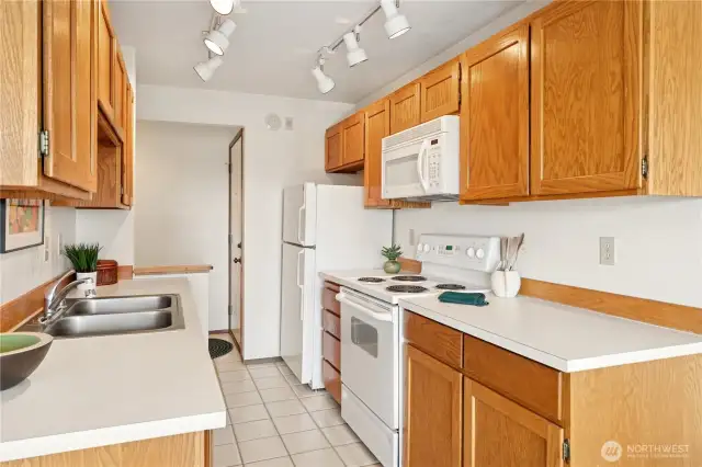 Front door is just past the fridge.