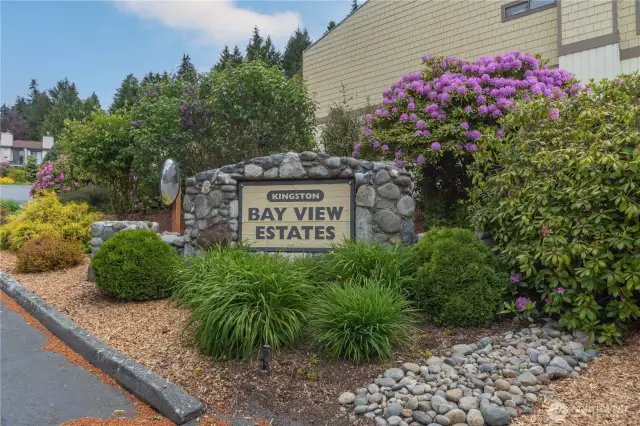 Beautiful spring trees and flowers adorn the entrance of the complex