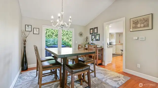 The dining area sits perfectly between the kitchen and the sliding glass door to the backyard!