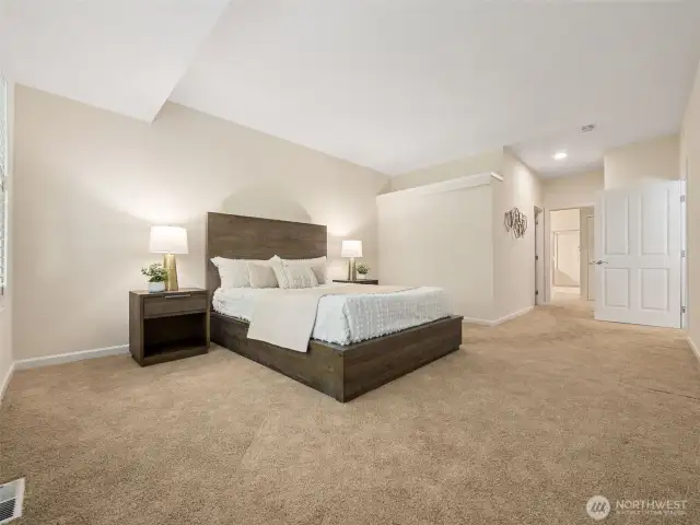 Spacious primary suite acccomodates a king sized bed, multiple dressers and even a big cozy reading chair, if you wish!