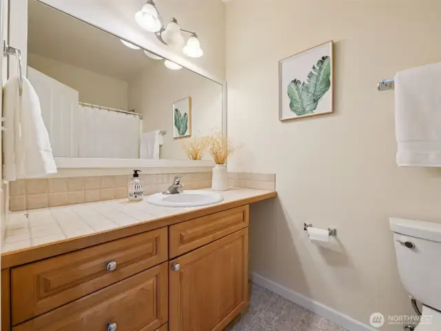 Full sized secondary bath with tub & shower.