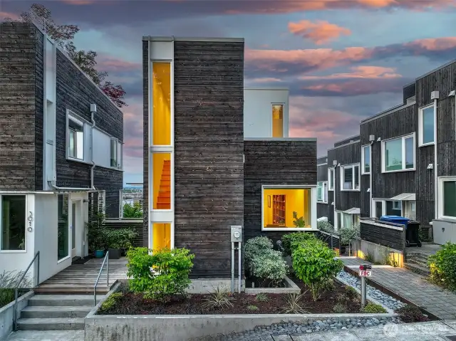 Welcome to Harold’s Place. At the heart of Harold’s Place—a hillside community envisioned by Graham Black of gProjects—this architect-designed home pairs bold modern form with natural textures and native landscaping, honoring the site’s orchard roots and spirit of connection.