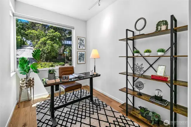 Work with a window to the world. Tucked into a quiet corner, the dedicated home office offers leafy outlooks and inspiring light—ideal for focus, creativity, or daydreaming between Zoom calls.