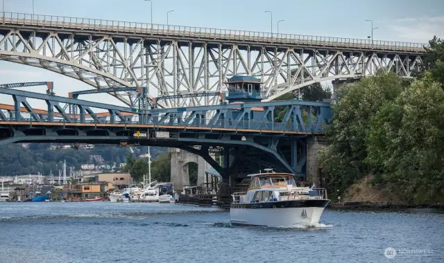 Where movement meets memory. Boats glide beneath the iconic Fremont Bridge, connecting neighborhoods, histories, and daily rhythms. Just below Harold’s Place, this working waterway reminds us that in Seattle, the journey is part of the view.