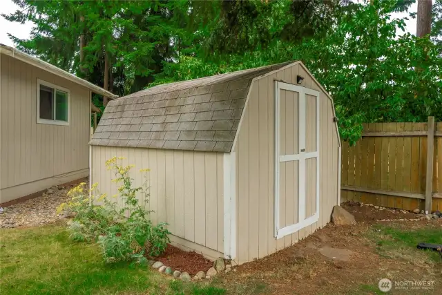 A spacious backyard shed offers convenient storage for tools, lawn equipment, and seasonal items. Its durable construction and easy-access double doors make it a practical addition for keeping your yard clutter-free and organized.
