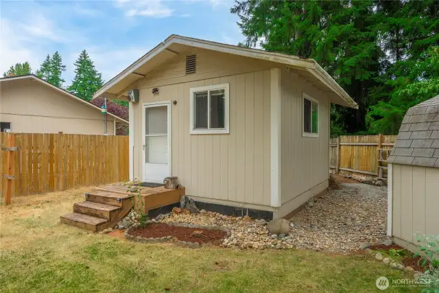 This versatile outbuilding is currently set up as additional living space and offers endless possibilities. With electrical already installed and water nearby, it could easily be transformed into a home office, art studio, gym, hobby space, or even a future ADU or she-shed retreat. Whether you're dreaming of a private workspace or a cozy getaway just steps from home, this flexible space is ready to meet your vision.
