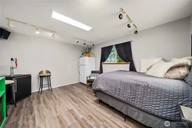 This finished outbuilding offers a bright and clean interior with durable laminate flooring, fresh paint, and dual-pane windows that bring in natural light. With electrical already in place and water nearby, this space is ready for your vision—whether that’s a home office, art studio, guest suite, or future ADU.