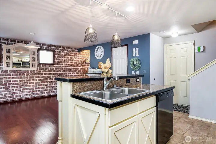Sweet country "brick" wall is quaint and adds  to that country feel - but is just paint and can be easily repainted to match your own decor!