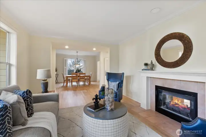 The living room seamlessly connects to the dining area and the rest of the lower level, making it ideal for entertaining.